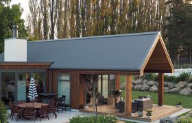 Outdoor dining pergola at dusk, Walnut Cottage heritage renovation Waitaki Valley
