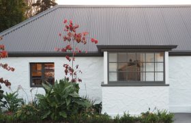 Original 150-year-old stone cottage facade as featured on Grand Designs New Zealand, Walnut Cottage